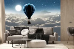 Fototapeta: Słoń w balonie unoszący się nad chmurami