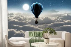 Fototapeta: Słoń w balonie unoszący się nad chmurami