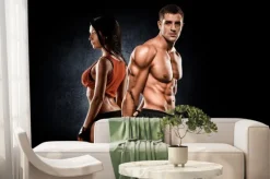 Fototapeta: Sportowiec para pozuje do kamery