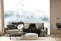 Fototapeta: Stado ptaków nad mglistym lasem