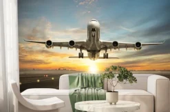 Fototapeta: Startujący samolot w świetle słońca