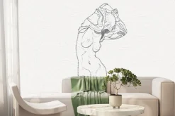 Fototapeta: Subtelna kobieta na tle liści