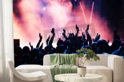 Fototapeta: Sylwetki tłumu koncertowego przed jasnym scenicznych świateł