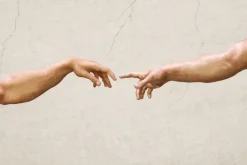 Fototapeta: Symboliczny dotyk dłoni artystyczna kompozycja na tle betonu