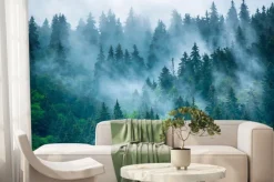 Fototapeta: Tajemniczy las we mgle na tle górskich szczytów