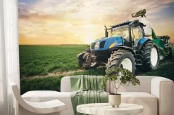 Fototapeta: Traktor na polu i zachód słońca