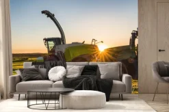 Fototapeta: Traktor na polu z maszynami rolniczymi