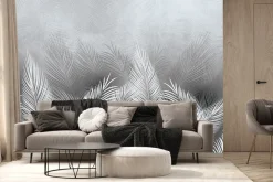Fototapeta: Tropikalne liście palmy w bieli i szarości z efektem betonu