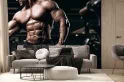Fototapeta: Umięśniony kulturysta trenuje na siłowni