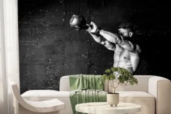 Fototapeta: Umięśniony mężczyzna trenujący z kettlebell