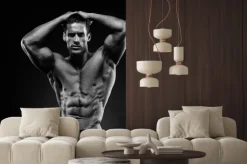 Fototapeta: Umięśniony mężczyzna na czarnym tle