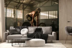 Fototapeta: Wysportowana kobieta podnosząca ciężary