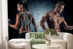 Fototapeta: Wysportowana kobieta i mężczyzna z ciężarami