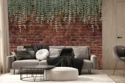 Fototapeta: Zielone rośliny zwisające na tle ceglanego muru