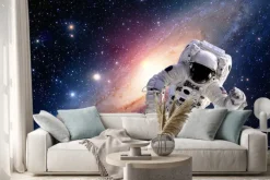 Naklejka: Astronauta w kosmosie na tle galaktyki