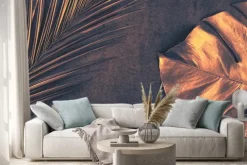 Naklejka: Closeup of bronze palm and monstera leaves on abstract dark purple