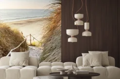 Naklejka: Plaża z widokiem na błękitne morze i zachodzące słońce