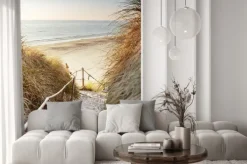 Naklejka: Plaża z widokiem na błękitne morze i zachodzące słońce