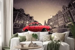 Naklejka: Retro czerwony samochód na brukowanej zabytkowego starego miasta