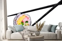 Naklejka: Roll sushi z czarnymi pałeczkami na białym tle