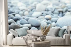 Naklejka: Round stones on a dry river bed outside in nature. smooth pebbles