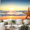 Naklejka: Rozgwiazdy na plaży o wschodzie słońca