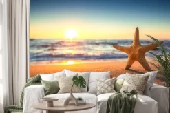 Naklejka: Rozgwiazdy na plaży o wschodzie słońca