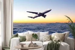 Naklejka: Samolot na niebie o świcie