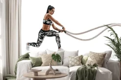 Naklejka: Sportowy kobieta trening z ciężkimi arkanami. fotografia sporty