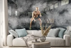 Naklejka: Sportowy młody człowiek z batalistyczną arkaną robi ćwiczeniu