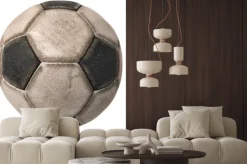 Naklejka: Stary piłka nożna na białym / fragment starych czarno-białe piłki