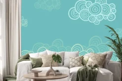 Naklejka: Stylizowane spiralne chmury na niebieskim tle