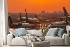 Naklejka: Sunset at the airport with airplanes ready to take off