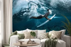 Naklejka: Surfer performs dive (the duck dive) with his surfboard under