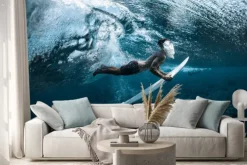 Naklejka: Surfer performs dive (the duck dive) with his surfboard under