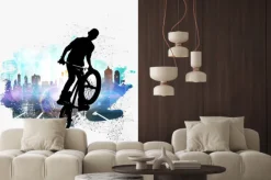 Naklejka: Sylwetka rowerzysty na tle nowoczesnego miasta