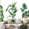Naklejka: Watercolor image with tropical leaves and leaves of indoor plants.