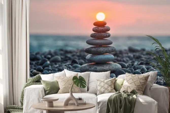 Naklejka: Wieża z gładkich kamieni na plaży o zachodzie słońca