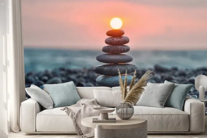 Naklejka: Wieża z gładkich kamieni na plaży o zachodzie słońca