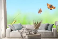 Naklejka: Zielona trawa, gąsienica i motyl