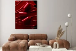 Obraz: Broken red lipsticks over smudged lipstick background