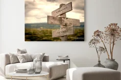 Obraz: Change is good quote on wooden signpost in nature with moody