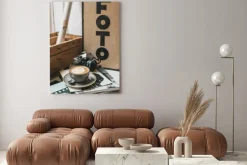 Obraz: Closeup of a cup of latte with an art pattern on a table in a