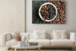 Obraz: Coffee beans and tea in leaves on the same plate