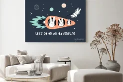 Obraz: Cute hares on a carrot rocket in space among the stars.