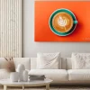 Obraz: Cyan coffee cup over orange background. top view flat lay with