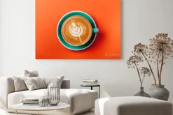 Obraz: Cyan coffee cup over orange background. top view flat lay with