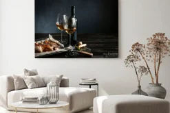 Obraz: Dinner concept for two. two glasses of white wine, baked fish.