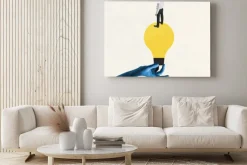 Obraz: Female blue hand holding electric bulb as idea symbol with young