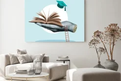 Obraz: Książka otwarta na dłoni symbol edukacji